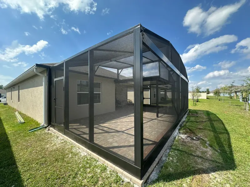 Panoramic Florida screened enclosure protecting a swimming pool