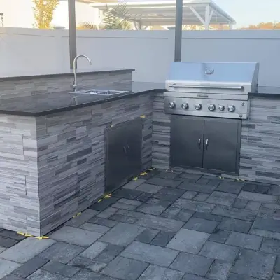 Modern outdoor kitchen builder Florida detail shot of built-in appliances