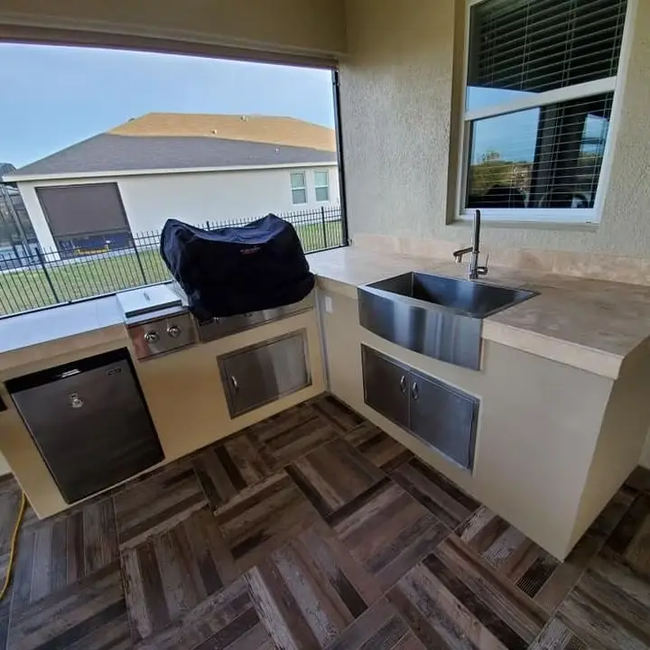 Luxury outdoor kitchens Florida design with pergola and lighting