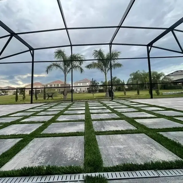 Landscape paver contractors near me installing a Florida patio with steps and lighting