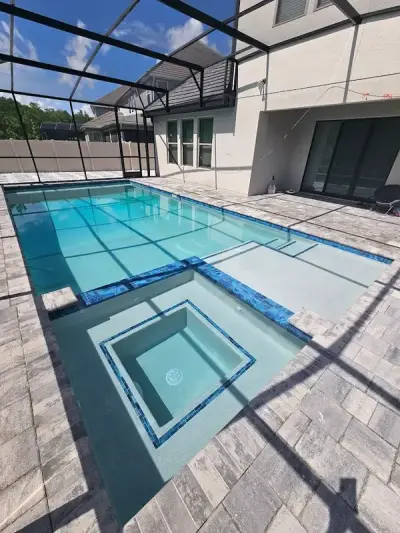 Backyard renovation with pool and pavers